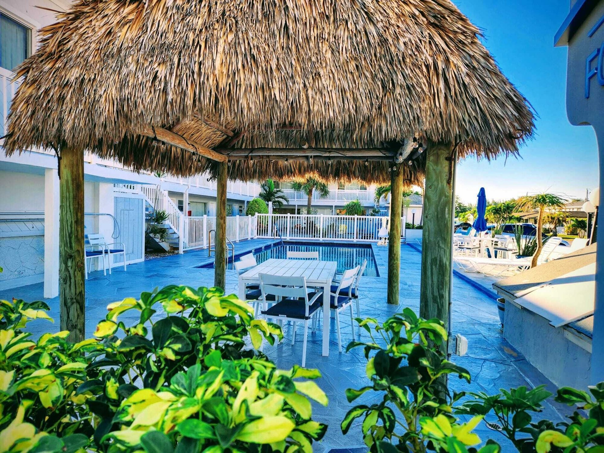 Outdoor pool and courtyard at The Palms On Ocean & Foodmart